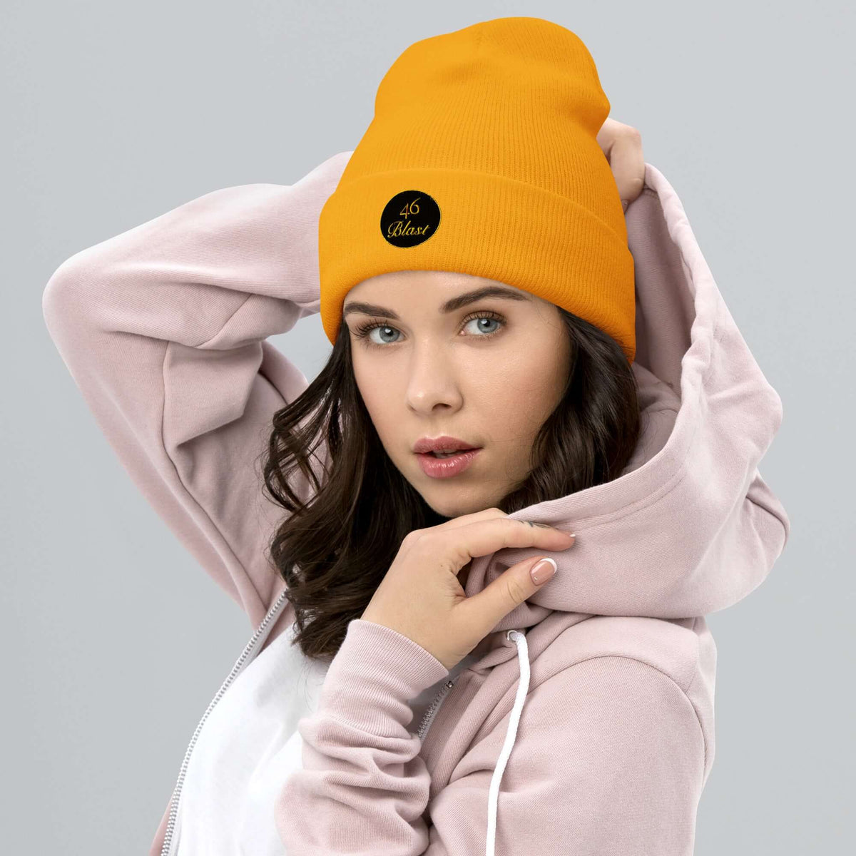 Woman wearing orange cuffed Beenie hat