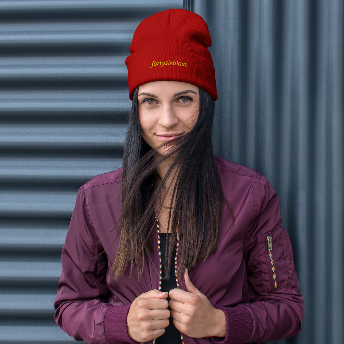 Woman wearing a red cuffed Beenie hat